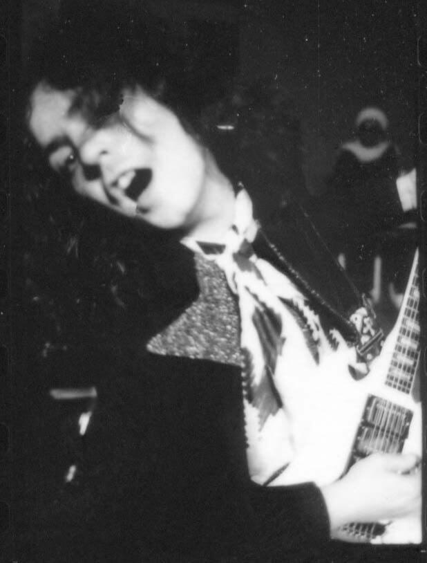 ID: black and white photo of marc bolan, frontman of the band T. rex.
